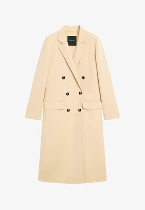 Beżowy dwurzędowy płaszcz wykonany z wełny, z klapowanym kołnierzem, dwoma przednimi kieszeniami i czarnymi guzikami. Gładka faktura, dopasowany krój.