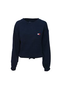 Felpa cropped blu navy con maniche lunghe a raglan, colletto crew a coste, lacci in vita e piccola patch con logo in rosso, bianco e blu sul petto.