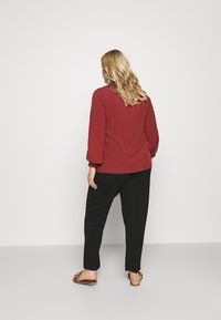 ONLY Carmakoma CARBETTY ANKEL SMOCK PANT - Calças - black