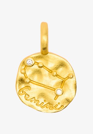 Złoty wisiorek z teksturowanym, okrągłym wzorem przedstawiającym konstelację Bliźniąt oraz wyraz "Bliźnięta" wytłoczony, ozdobiony małymi kryształkami.
