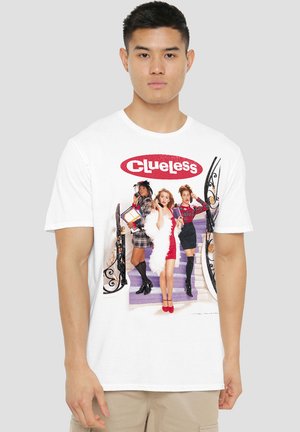 White cotton t-shirt featuring a colorful graphic of three stylized figures from "Clueless" against a decorative background.