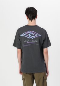 Gray cotton t-shirt with short sleeves, featuring a large iridescent logo and text on the back. Casual design with a relaxed fit.