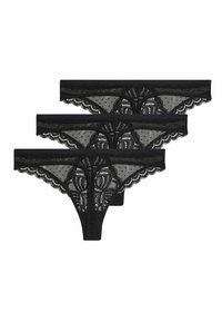 Drie paar zwarte kant thongs met geschulpte randen en ingewikkelde bloempatronen, met doorzichtige gaaspanelen en stippendetails.