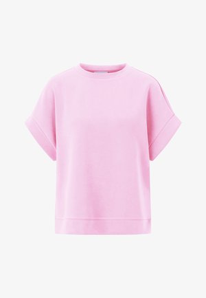 Rožinė medvilninė oversize marškinėliai su trumpomis suknegtomis rankovėmis, apvalia iškirpte ir tiesiu apačioje. Lygus audinys be matomų raštų ar akcentų.