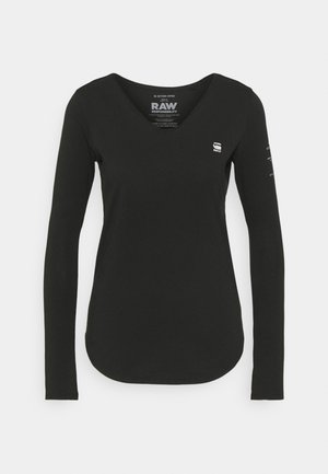 Black long-sleeve women's V-neck shirt with small white logo on chest and text on right sleeve, front view on plain background.