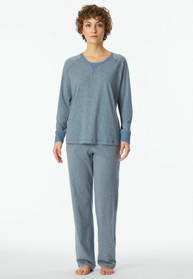 Light blue pajama set made of soft material, featuring long sleeves, ribbed cuffs, and relaxed-fit pants. Simple design without patterns.