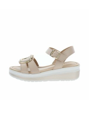 Sandale beige à talon compensé ouverte à l'avant, avec deux brides, boucle dorée sur la bride de cheville et détail décoratif doré sur la bride avant, semelle blanche.