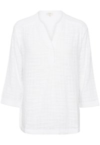 Hvid linnedbluse med en struktureret overflade, med V-hals og trekvartærmer. Enkel, afslappet pasform.