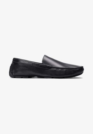Black leather slip-on shoes with a smooth upper, rounded toe, and textured side panel. Features minimal stitching and rubber sole.