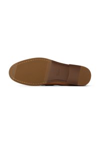 Brown leather shoe sole with textured rubber for grip, featuring stitched accents along the edges and a smooth, wide design for comfort.