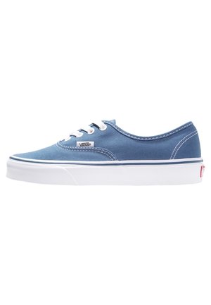 Blauwe Vans canvas lage sneakers met witte veters, witte rubberen zool en gestikte details aan de zijkant en hiel.