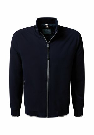 Marineblaue Jacke mit Reißverschluss, Stehkragen, langen Ärmeln, Frontreißverschluss und dezenten weißen Abschlüssen an Bündchen und Saum.