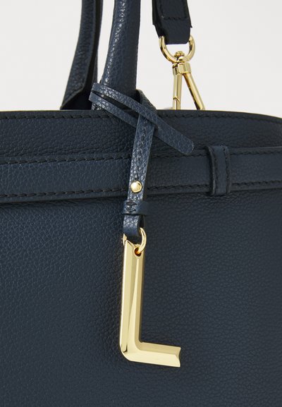 Нavy blue leather handbag with a textured finish, featuring a gold "L" accent and secure strap attachment. Simple design with clean lines.