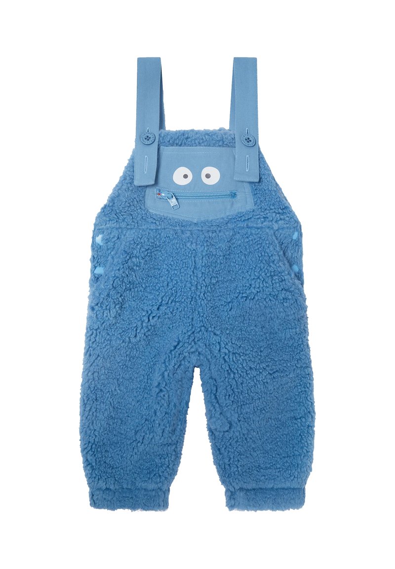 Salopette bleue en peluche pour tout-petits avec des bretelles ajustables, une poche zippée à l'avant et des yeux ludiques au-dessus de la poche qui ressemblent à un visage.