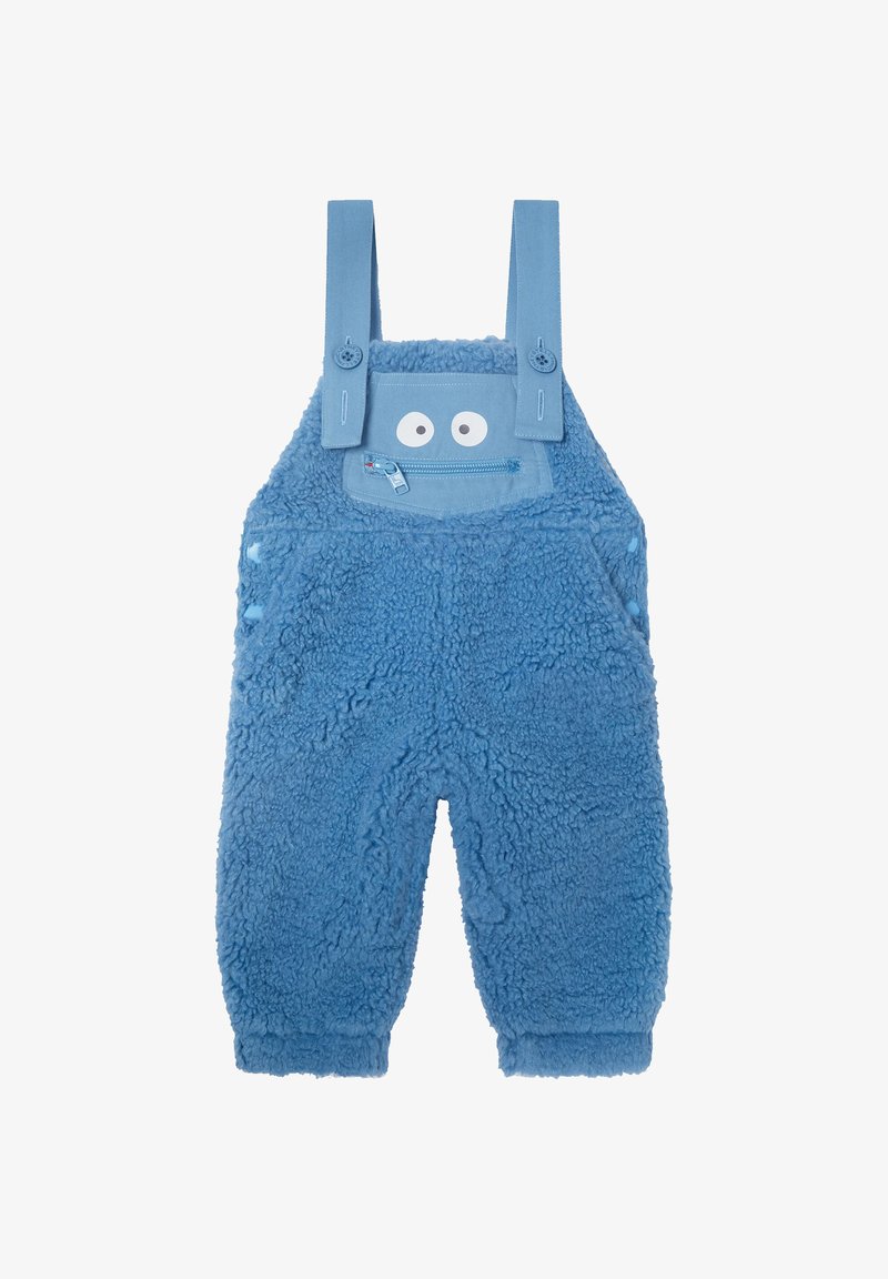 Salopette bleue en peluche pour tout-petits avec des bretelles ajustables, une poche zippée à l'avant et des yeux ludiques au-dessus de la poche qui ressemblent à un visage.