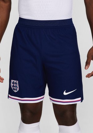Pantaloni sportivi navy con un design testurizzato, logo Nike bianco e un orlo a strisce bianco/rosso/blu. Presenta un emblema dell'Inghilterra sulla coscia sinistra.