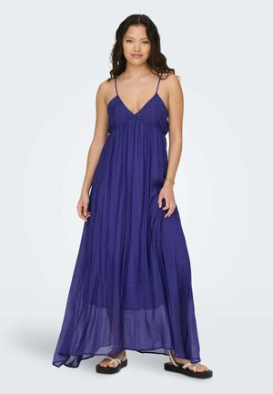 Vestido maxi largo y fluido en tela de color púrpura profundo con escote en V, tirantes ajustables y una textura ligera y aireada.