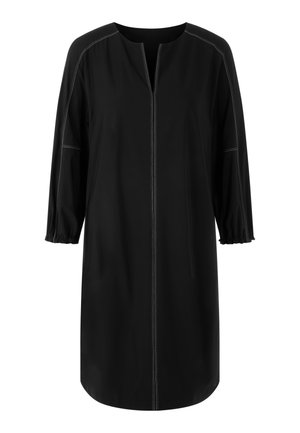 Schwarzes Kleid mit rundem Ausschnitt, 3/4-Ärmeln und gerafften Bündchen. Mit kontrastierenden weißen Nähten entlang der Nähte und einer vorderen Öffnung.