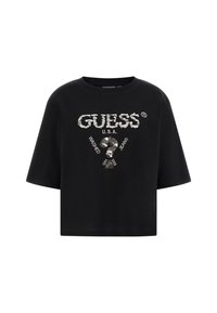 Černý krátký rukávový crop top s textem ze stříbrných flitrů "GUESS U.S.A." a otazníkem, s nápisem "Washed Jeans" kolem něj.