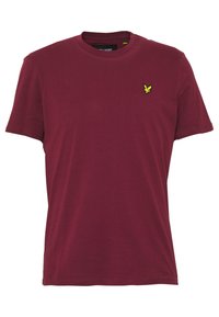 Burgundská bavlněná tričko s klasickým kulatým výstřihem, krátkými rukávy a malým žlutým vyšitým logem na levém hrudníku. Hladká textura.