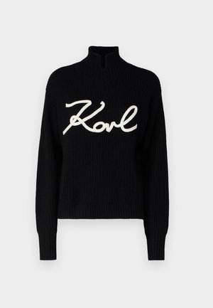 Black ribbed knit sweater with a high neck, featuring a prominent white embroidered "Karl" logo across the front.