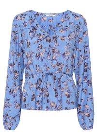 Blusa floreale blu con maniche lunghe, caratterizzata da una vita arricciata, un accento a fiocco e un motivo di fiori viola e beige su un tessuto liscio.