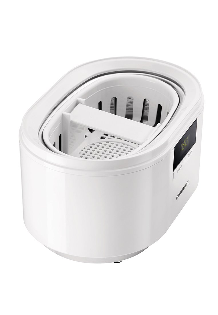 Nettoyeur ultrasonique ovale blanc avec un panier intérieur transparent, un affichage numérique, des boutons de commande et des trous de drainage dans le panier amovible.