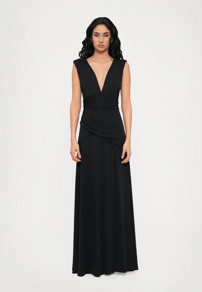 Black sleeveless maxi dress with a deep V-neckline, fitted bodice, and draped detail at the waist, made from a smooth, stretchy fabric.