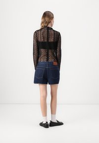 Tommy Jeans HOT PANT - Denim shorts - denim dark