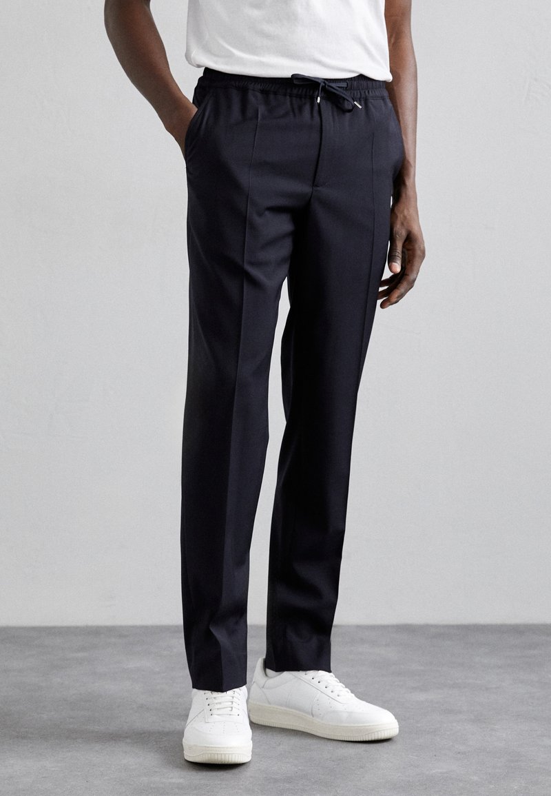sandro ALPHA - Pantalones chinos - marine