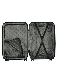 Open black hard-shell suitcase showing two compartments, one with a zippered divider, and the other with crossed straps for securing items.