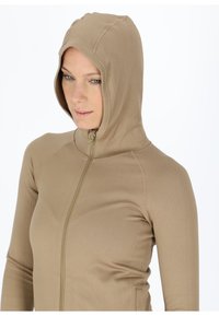 Kapuzensweatshirt aus hellbraunem Rippmaterial mit durchgehendem Reißverschluss, langen Ärmeln und nahtlosem Design für Komfort und Flexibilität.