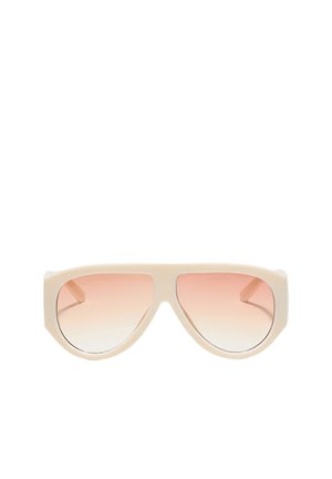 Cremefarbene Piloten-Sonnenbrille mit großen, verlaufend rosa getönten Gläsern und dickem Rahmen auf weißem Hintergrund.