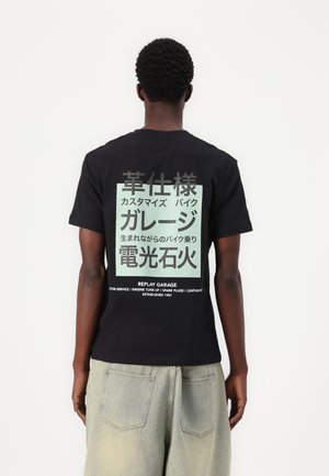 T-shirt con stampa - black