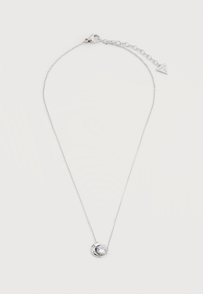 Collier en argent avec pendentif croissant de lune et étoile tenant une pierre précieuse ronde transparente, doté d'un fermoir à chaîne réglable.