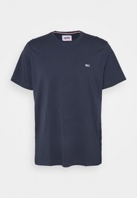 Marineblaue Kurzarm-T-Shirt mit Rundhalsausschnitt und kleinem Tommy Jeans-Logo auf der linken Brust sowie einem gebrandeten Nackenlabel.