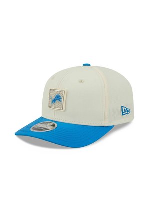 White and blue baseball cap with a blue lion logo patch on front and New Era logo on the side.