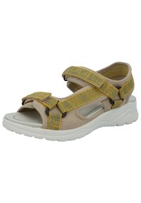 Beige sandal with yellow and blue patterned adjustable straps, mesh design, open toe, cushioned footbed, and white rubber sole.
