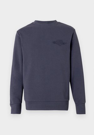 Donkerblauwe sweatshirt van zachte stof, met een ronde hals en geribde manchetten. Geborduurd logo op de linkerborst.