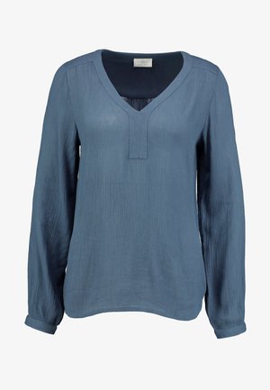 Bluză albă albastră cu mânecă lungă, decolteu în V și material texturat. Prezintă o croială lejeră și mansete răsucite pentru un aspect casual.