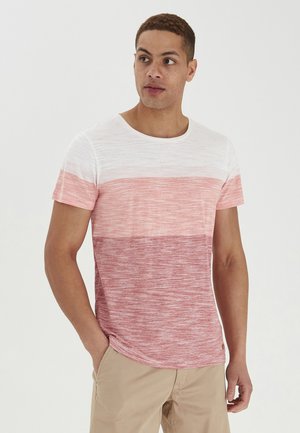 Short-sleeve t-shirt featuring a gradient design in white and shades of pink. Made of a textured fabric with a round neckline.