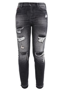 Mustat revenneet skinny-farkut korkealla vyötäröllä, joissa on kuluneet ja nypitty yksityiskohta polvissa, valmistettu denim-materiaalista.