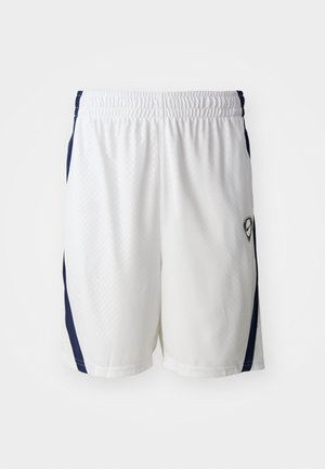 White athletic shorts with a textured fabric, elastic waistband, and navy side accents. Features a small logo on the lower right side.