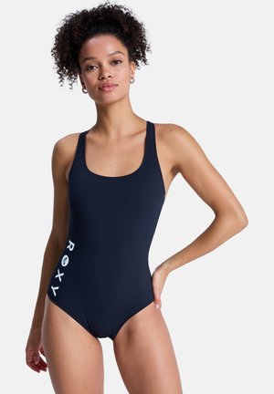 Marineblauer Einteiler-Badeanzug mit quadratischem Ausschnitt und breiten Trägern. Mit weißem "ROXY"-Logo auf der linken Seite. Glatter, dehnbarer Stoff.