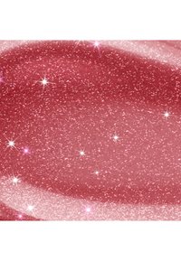 Glossy rose à lèvres rose avec de fines paillettes scintillant sous la lumière sur une surface lisse des lèvres.