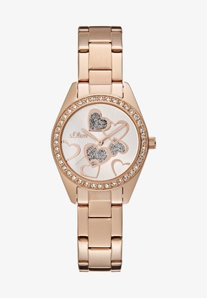 Reloj de pulsera de oro rosa con bisel incrustado de cristales, motivos decorativos de corazones brillantes en esfera blanca y correa de brazalete metálico enlazado.