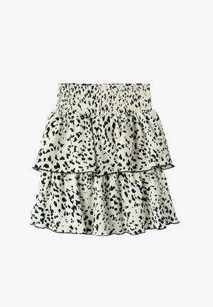 Falda de capas con cintura elástica, con una tela crema con patrones de salpicaduras negras. Diseño ligero y fluido.