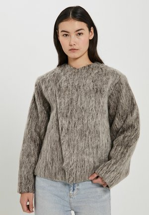 Brown and gray wool sweater with a textured finish, oversized fit, and wide sleeves. Features a unique wrap design at the neckline.