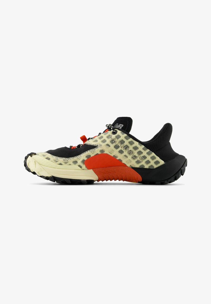 Multi-colored athletic shoe with a black upper, mesh texture, translucent yellow panels, red accents, and a rugged black outsole.