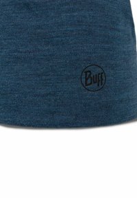 Blue knitted headband with a textured pattern, featuring a black "Buff" logo on one side. The fabric appears soft and stretchy.